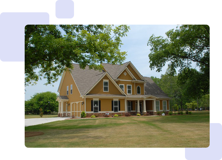 A yellow house sitting in the middle of a field.