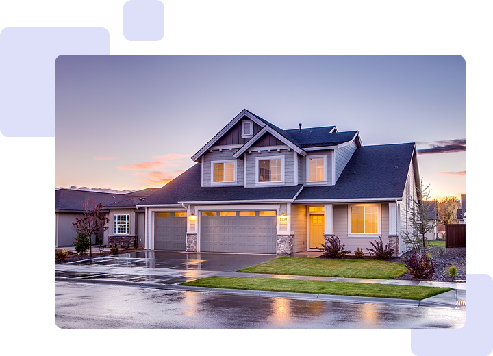 A house with a garage and driveway in front of it.